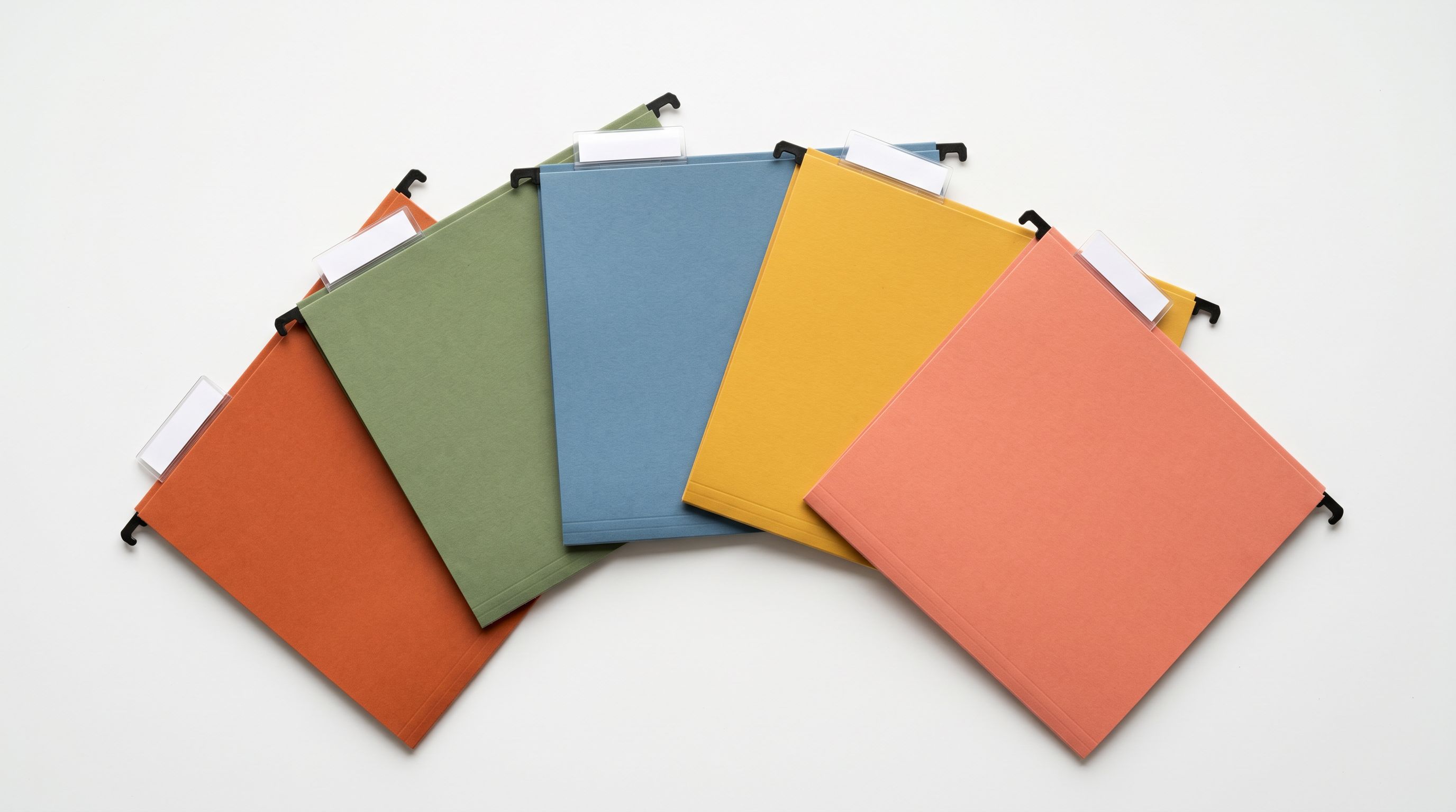 Colour-coded hanging file folders in a fan formation representing different product category groups.
