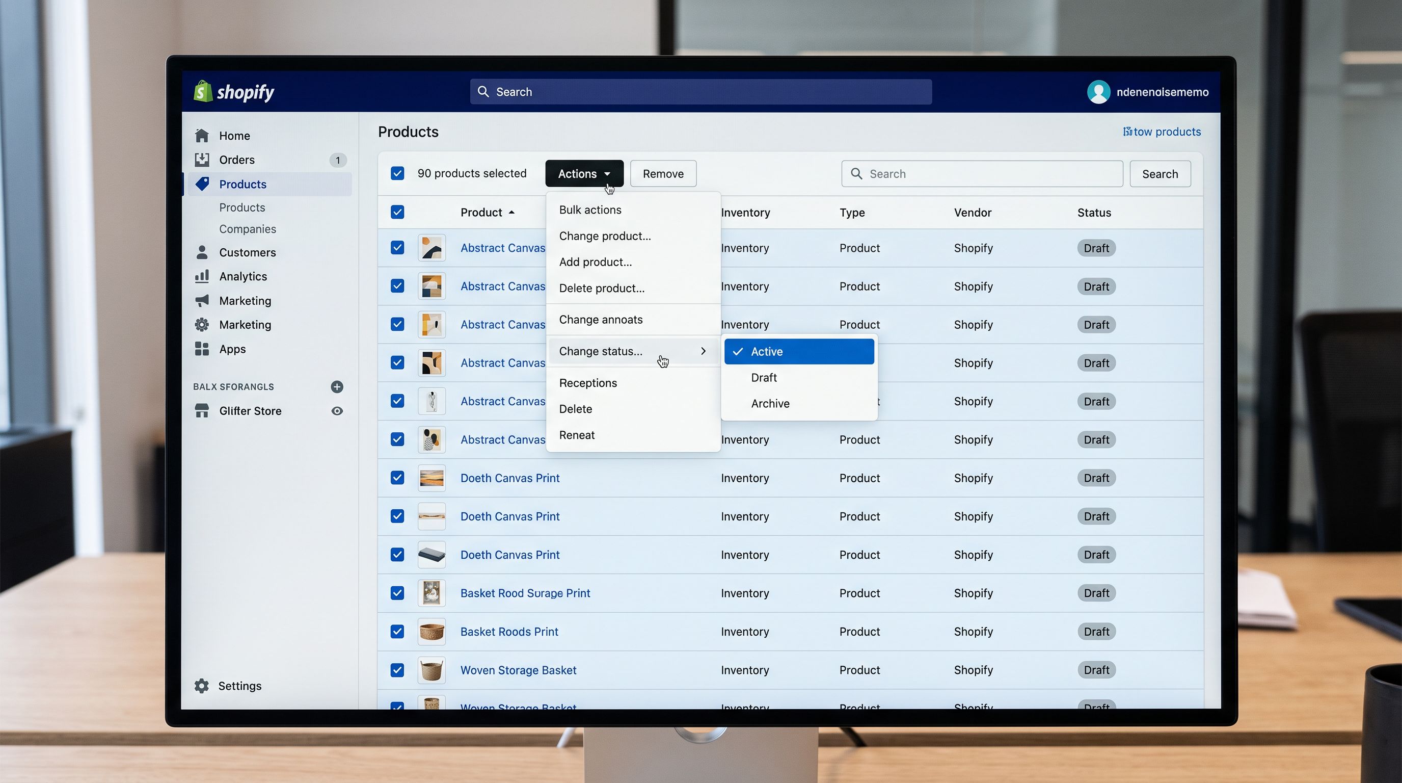 A Shopify admin product list on a monitor filtered to show only Draft status products with the bulk action menu open showing the Change status option highlighted and Active selected, with 90 products selected and a confirmation count visible, representing the moment of a coordinated batch publish, sharp focus, colour photography.